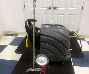 close up of push gray carpet extractor for rent